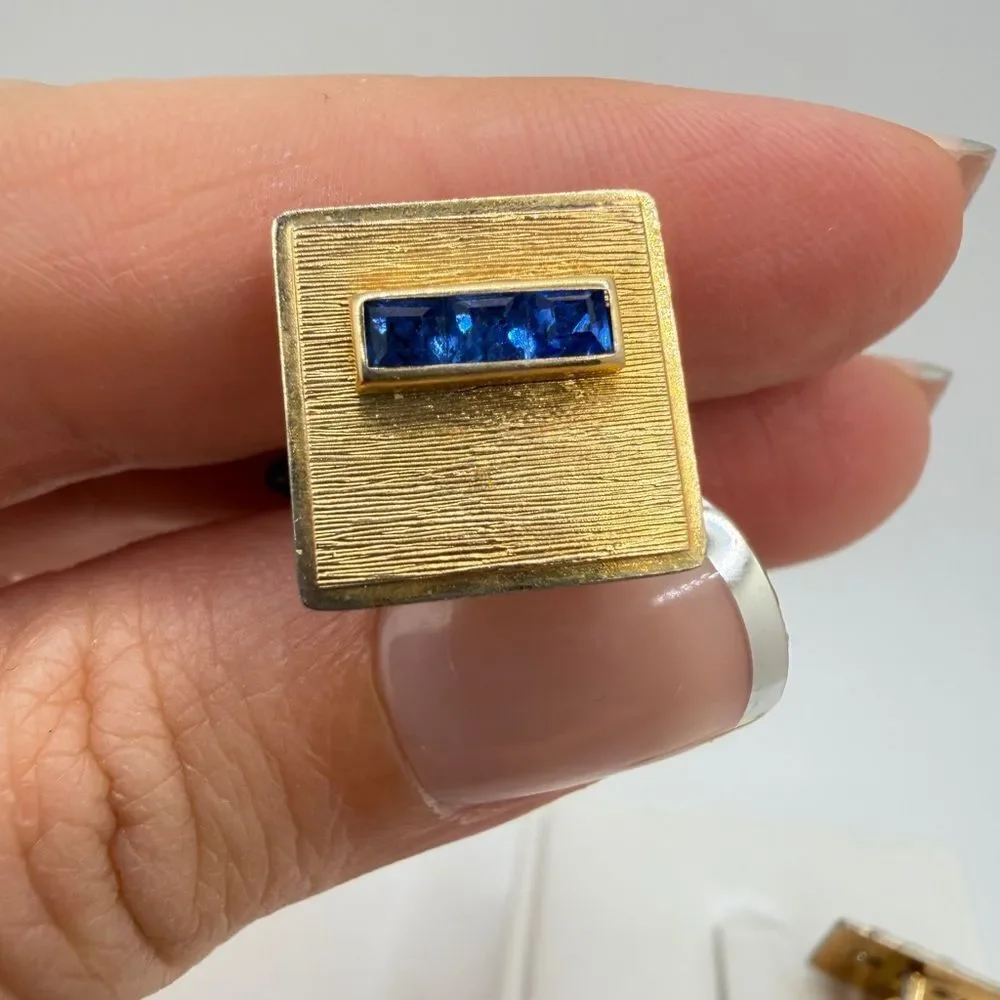 Vintage Krementz Gold tone cuff likes with princess cut blue rhinestone accents!